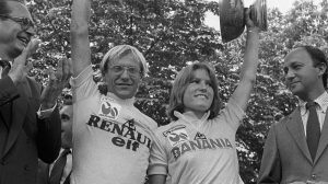 Tour de France winners Frenchman Laurent Fignon and Marianne Martin of the United States smile on the podium on July 22, 1984 in Paris, surrounded by Paris Mayor Jacques Chirac (L) and Prime Minister Laurent Fabius. Fignon reveals, on June 11, 2009 in Paris during the recording of a TV show released on June 14, that he suffers from and advanced stage cancer, but that there are no links with doping products. Fignon won the Tour de France in 1983 and 1984. AFP PHOTO FILES / AFP PHOTO / FILES        (Photo credit should read /AFP via Getty Images)