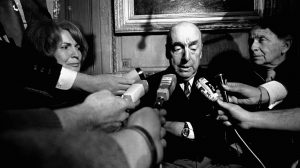FILE - This Oct. 21, 1971 file photo shows Pablo Neruda, poet and then Chilean ambassador to France, talk with reporters in Paris after being named the 1971 Nobel Prize for Literature. Chiles government is acknowledging that Neruda might have been killed after the 1973 coup that brought Gen. Augusto Pinochet to power. The Chile's Interior Ministry released a statement Thursday, Nov. 5, 2015, amid press reports that Neruda might not have died of cancer . (AP Photo/Laurent Rebours, File)